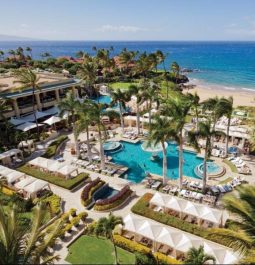 aerial view of beachfront resort pool in hawaii