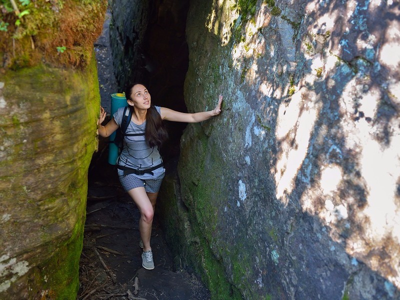 Woman exploring cave