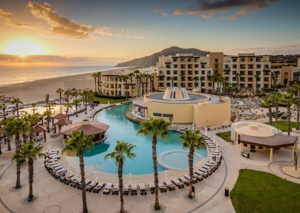 outdoor pool next to hotel and ocean