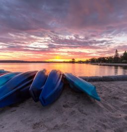 kayaks on water at sunset