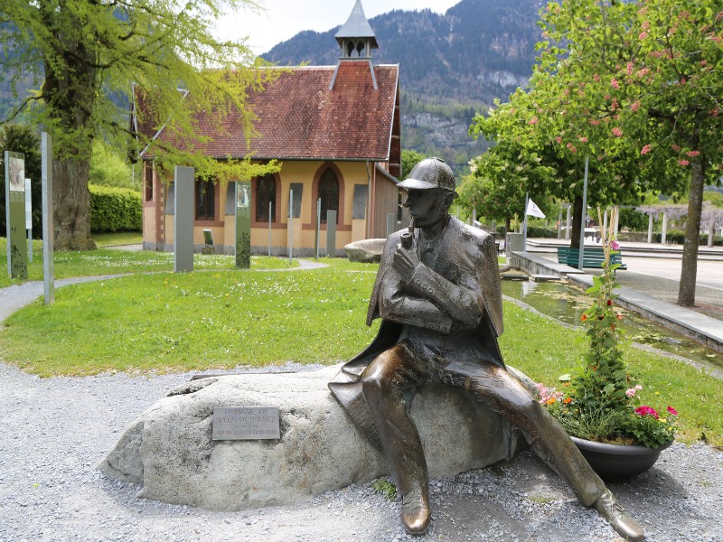 Statue of Sherlock Holmes in front of the Sherlock Holmes Museum in Meiringen, Switzerland