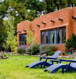 lounge chairs outside adobe building
