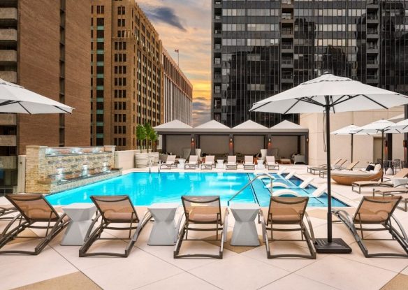 rooftop swimming pool with loungers around the pool