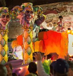 parade with orange float with krewe of boo