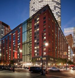 exterior of Conrad New York Downtown at night