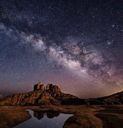 Desert rock formations with beautiful sky lit up with stars