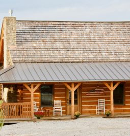 Front of cabin with rocking chairs on porch