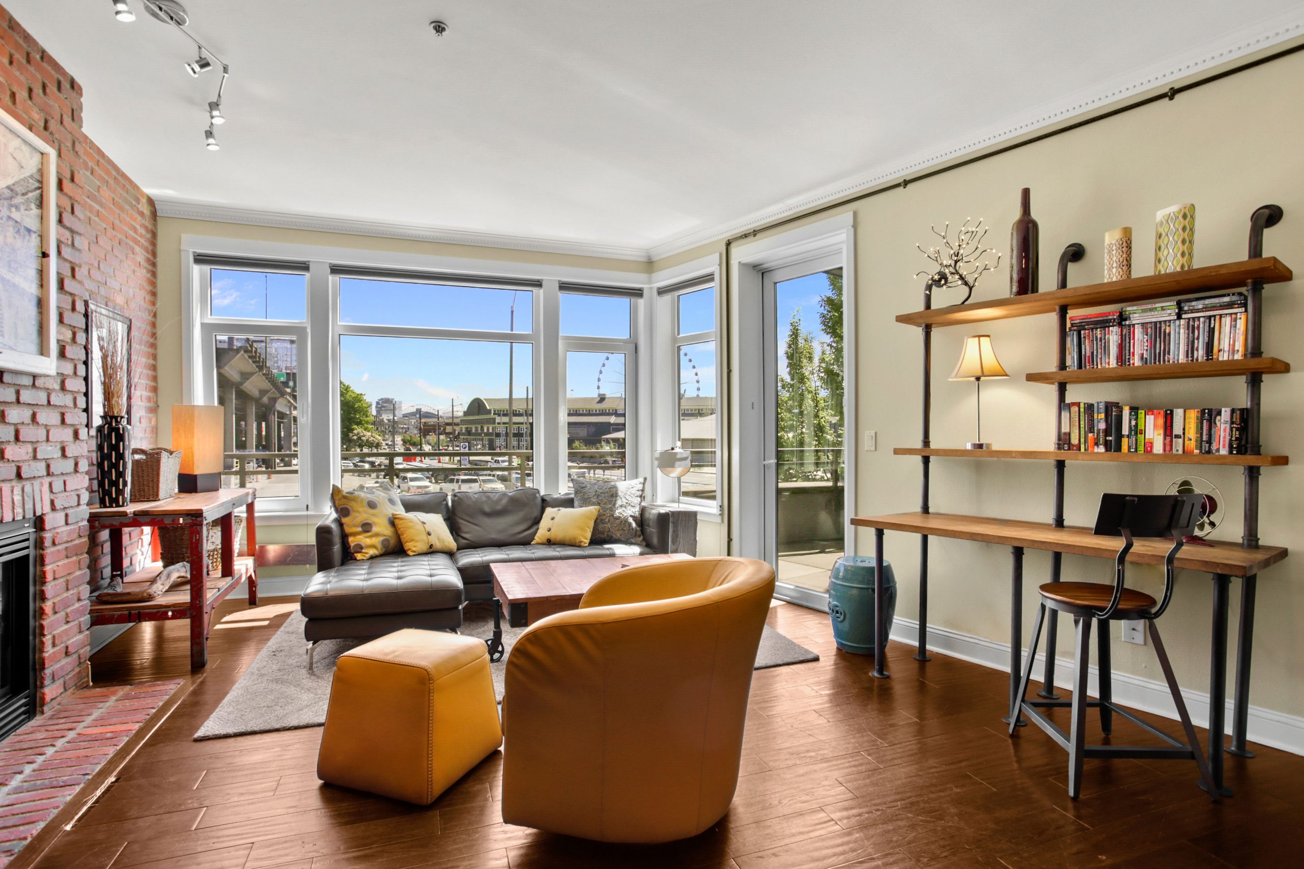 Spacious living room with floor to ceiling windows 