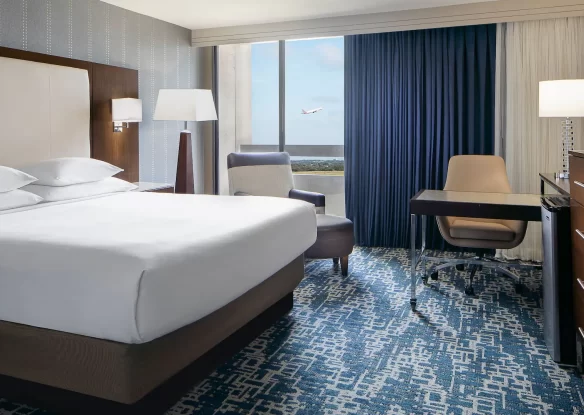 Hotel room with an airport runway view through the window